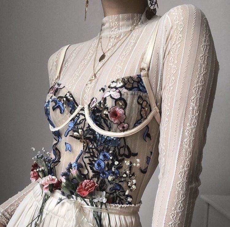 Flower bustier over a long sleeved top